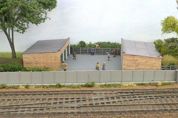 Children play Cowboys & Indians in a local garage block while a ‘busy-body’ looks on in disapprovingly. On a garage roof a cat decides the railway is more interesting.
www.EwhurstGreen.com
