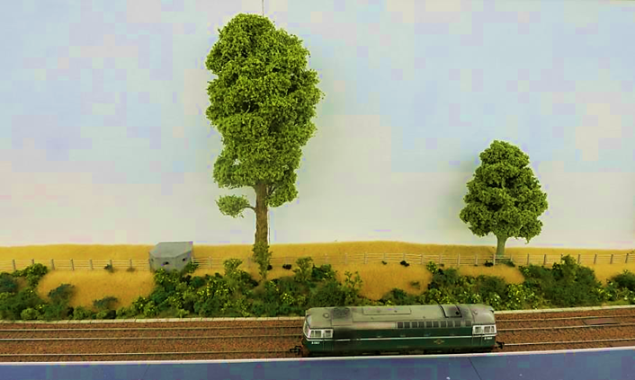 Type-24 concrete Pill Box (Wills kit SS74)
The farm field beyond the fence is to 
the eastern side of the railway station. 
www.EwhurstGreen.com 
