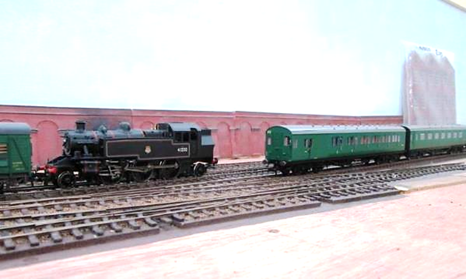 Ivatt no.41250 passes pull-push set 610 (being propelled by no.31518)